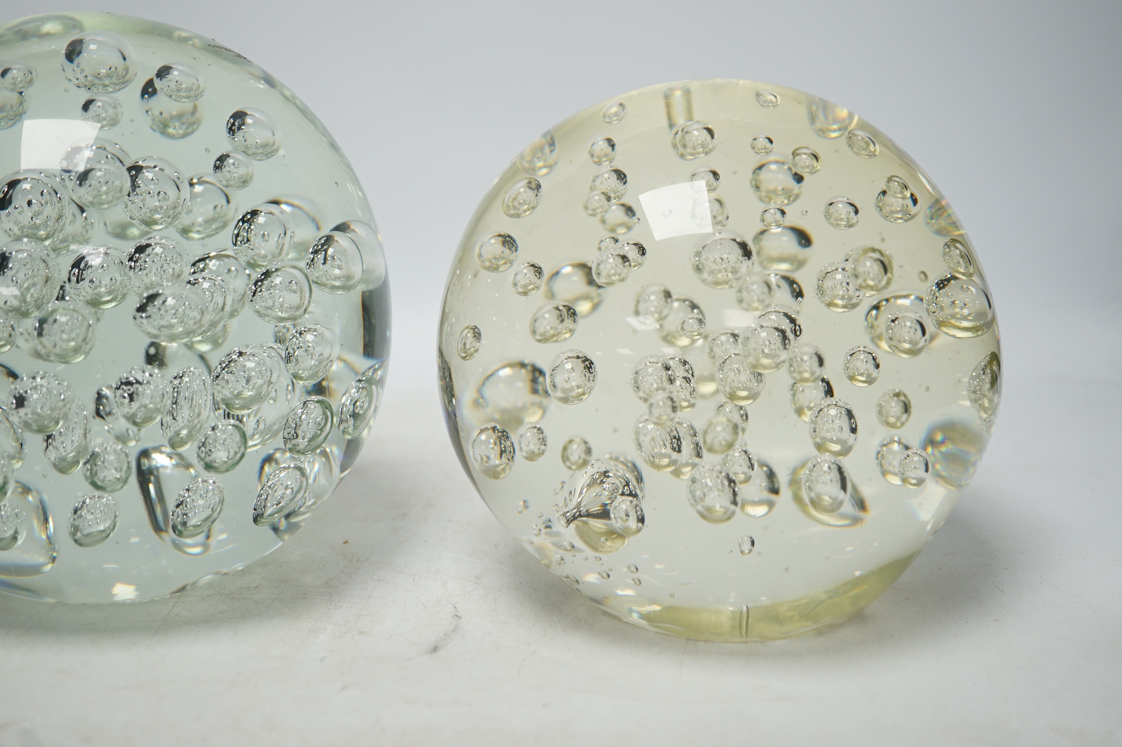 Two large glass bubble included door stops, 18cm. Condition - fair